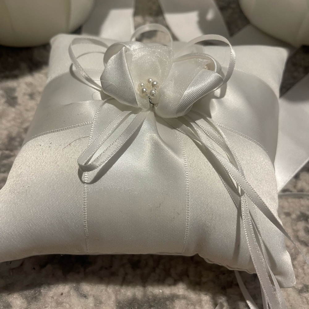2 flower girl baskets, and one ring bearer pillow. Satin/white/pearl.